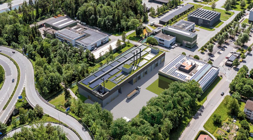 Das Bild zeigt eine Luftaufnahme des Geländes an der Weidachstraße mit dem Rendering des geplanten Biomasse-Heizkraftwerks der Nahwärme Weidach GmbH.
